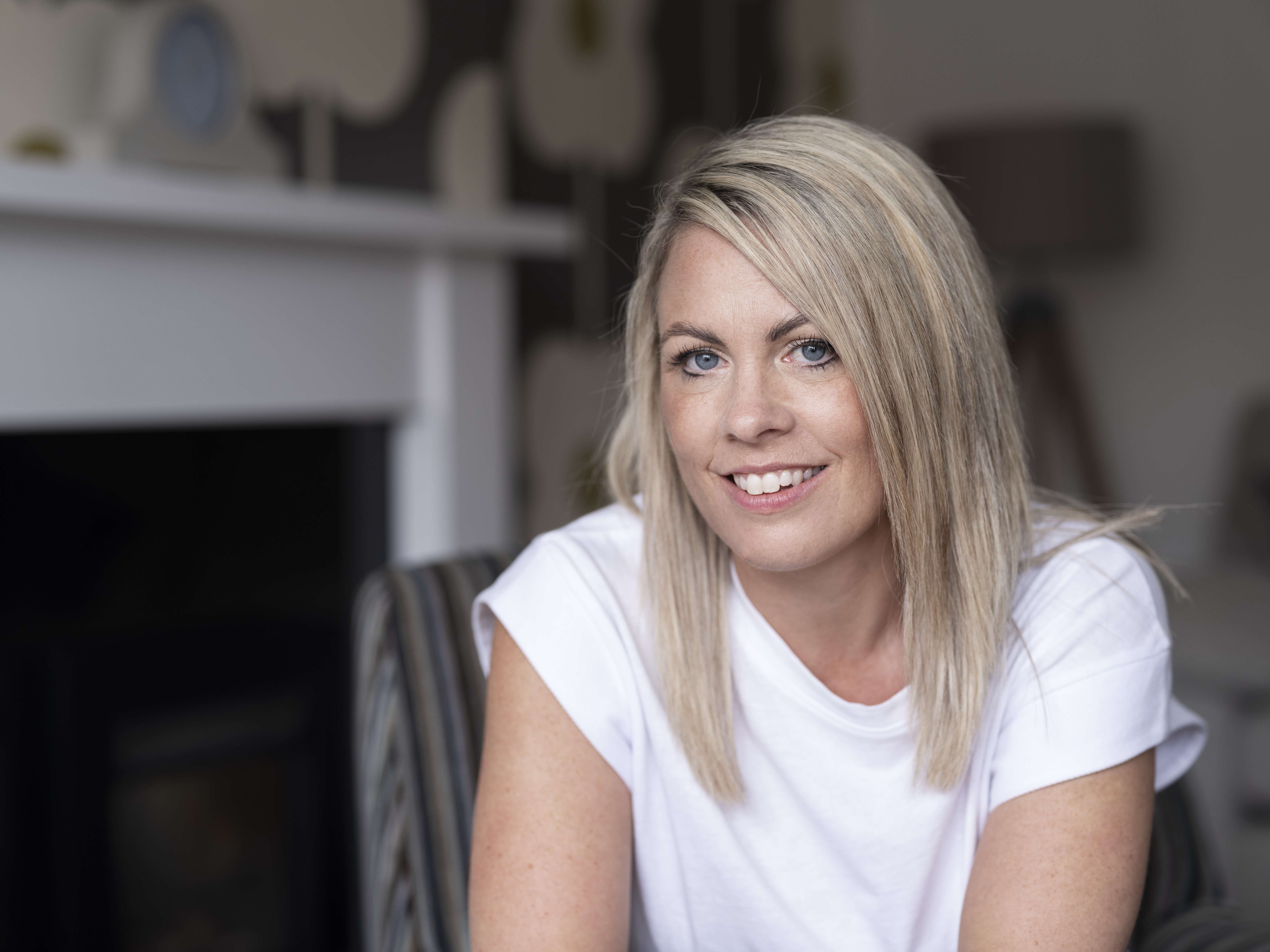 Laura, an intermittent catheter and Peristeen Plus user, sitting.